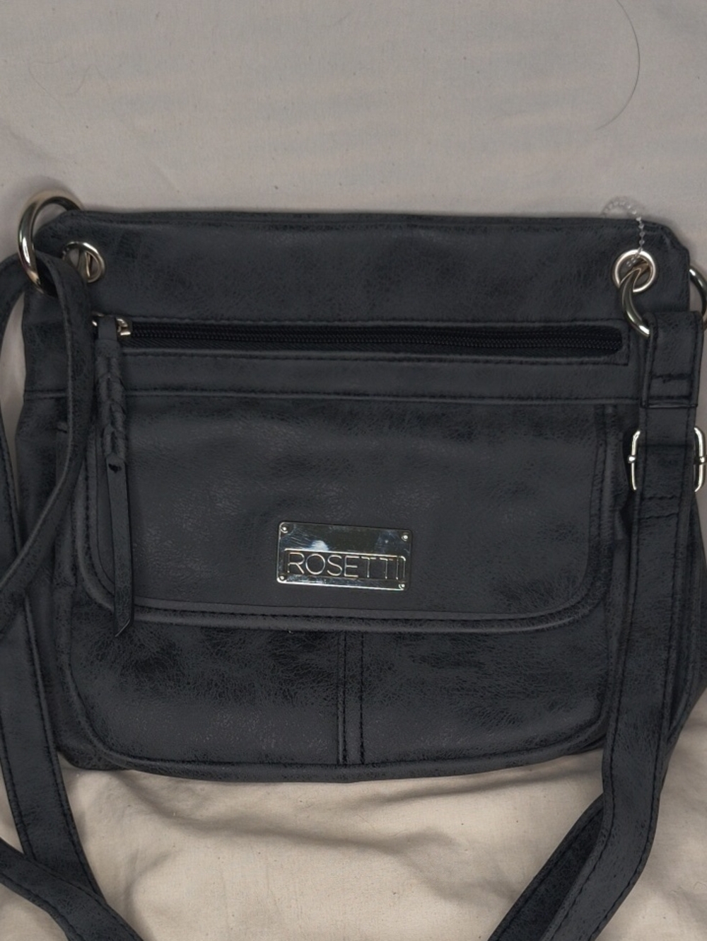 Rosetti Black Faux-Leather Adjust Crossbody with Front Flap and Logo Plate AE